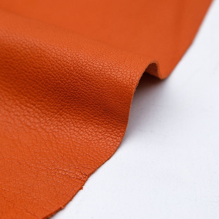 Orange matte finish cowhide leather