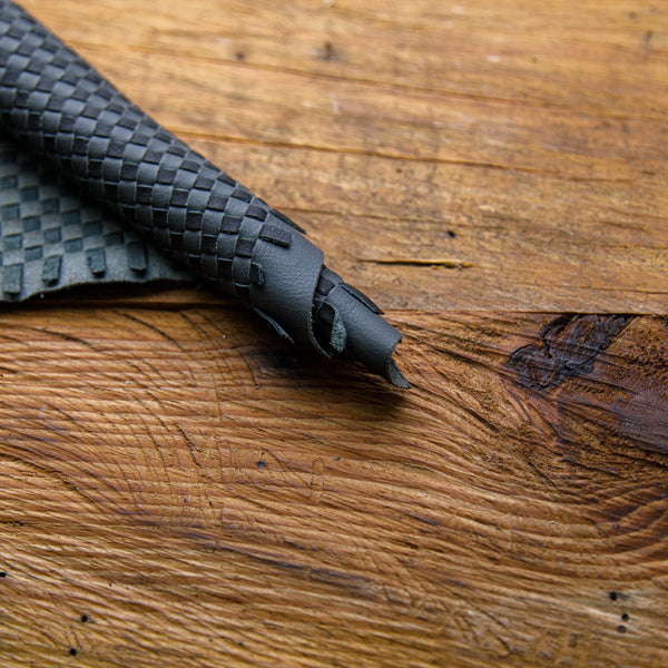 black and gray woven leather