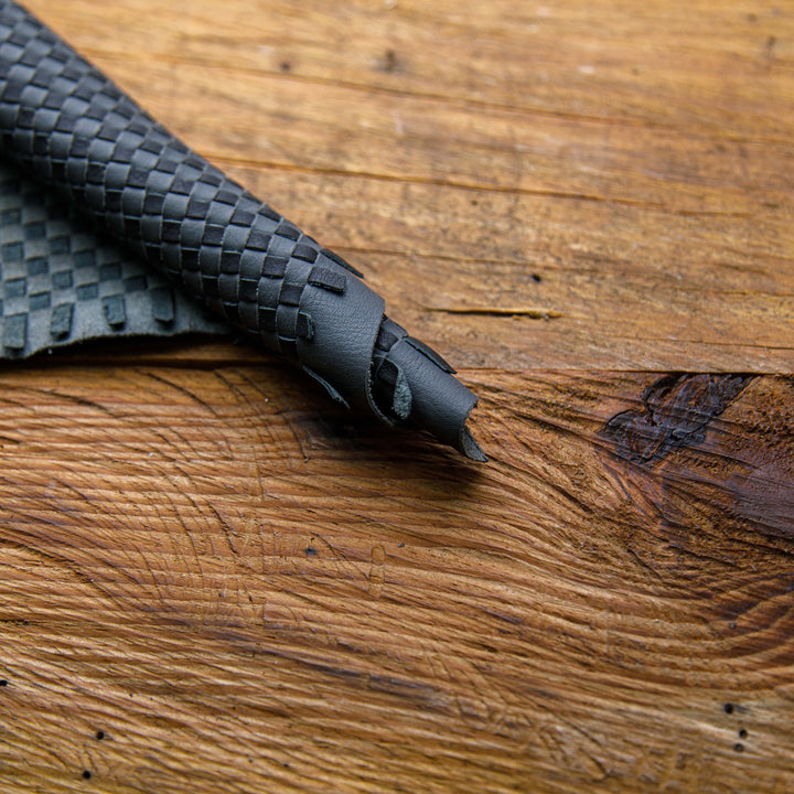 black and gray woven leather