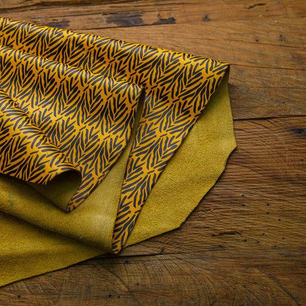 Black Leaves Pattern Printed Cowhide Yellow Leather