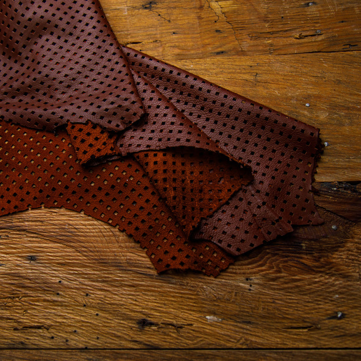 perforated maroon leather hide