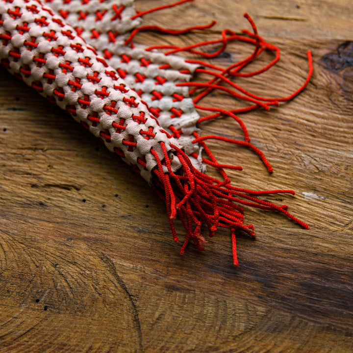 red and white woven leather hide